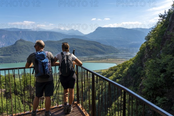 View from the hiking trail of the Rastenbach gorge to Lake Kaltern, near the village of Kaltern, in