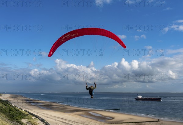 Paragliders along the dunes of Zoutelande, in Zeeland, South Holland, Netherlands