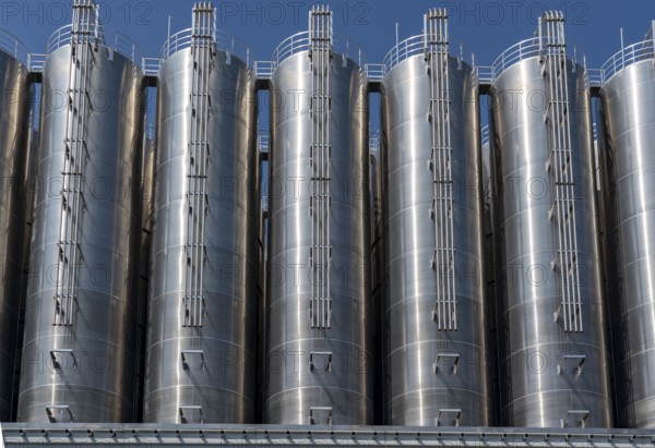 Stainless steel tanks of a large silo facility in Duisburg inland harbour, Duisburg-Neuenkamp, for