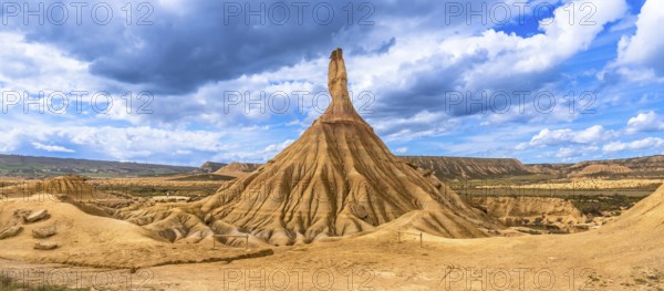 Eroded rock formations standing tall in the bardenas reales desert in navarre, spain, under a