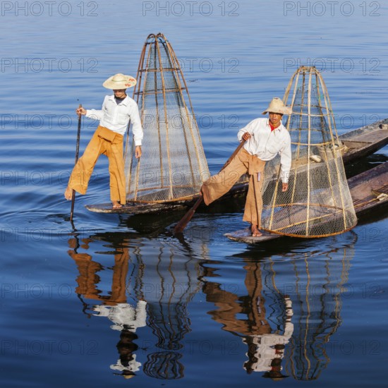 Myanmar travel attraction landmark, Traditional Burmese fishermen with fishing net at Inle lake in