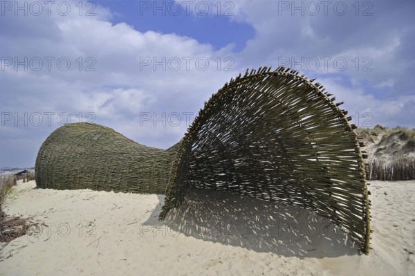 Sandworm by artist Marco Casagrande in the dunes during Beaufort04 at De Haan, Wenduine, Belgium,