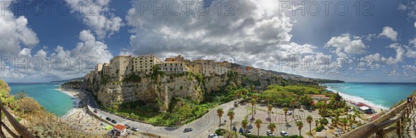 Panorama of the medieval old town of Tropea perched on rocks of sandstone with its turquoise sea