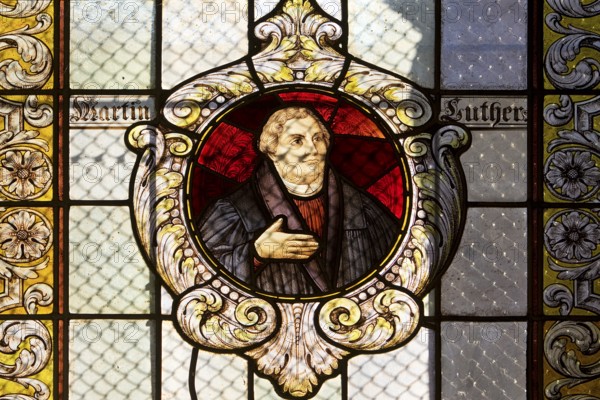 Stained glass window with Martin Luther in the Evangelical Lutheran Market Church of St Cosmas and