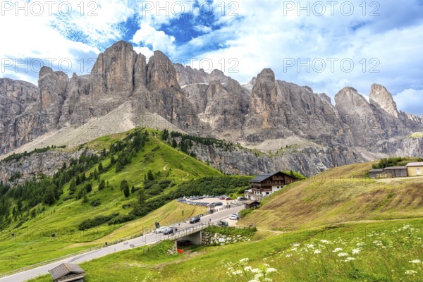 Breathtaking landscape showing the winding road of passo gardena and the majestic mountain range of