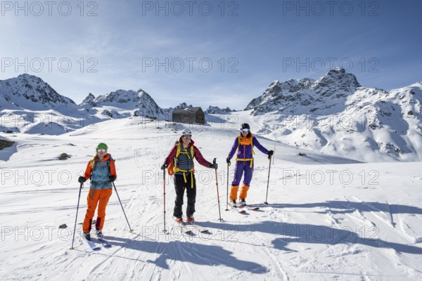 Ski tourers at the Kesch hut, Alpine Club hut of the SAC in winter, Albula Alps, Grisons,
