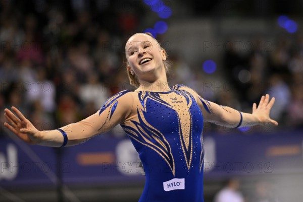Silja Stöhr GER cheers after her routine on the balance beam Gymnastics action, EnBW DTB-Pokal,