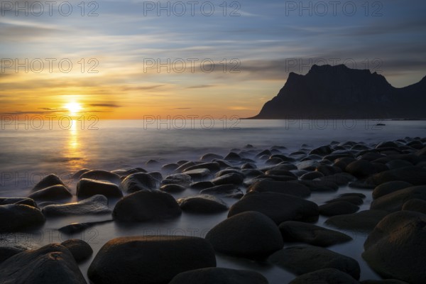 Seascape on the beach at Uttakleiv (Utakleiv), in the foreground round stones in the sea. In the