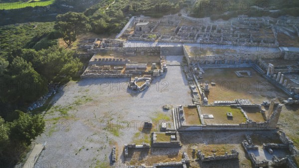 Drone shot, first morning light, backlight, Ancient ruins in an archaeological site, surrounded by