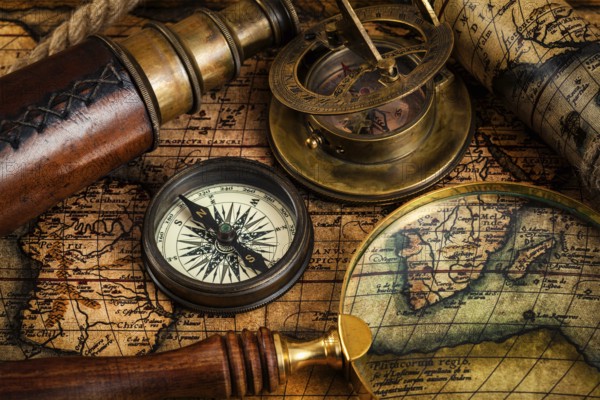 Travel geography navigation concept background, old vintage retro compass, sundial, magnifying