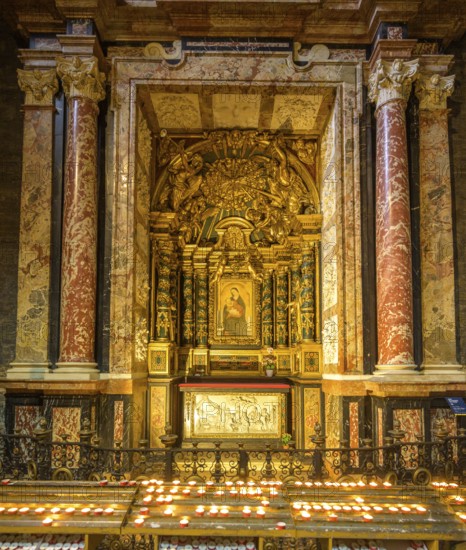 Golden side altar with image of the Virgin Mary and burning candles, Cathedral of Santa Maria