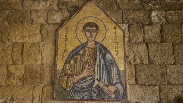 Monastery of Our Lady of Mount Filerimos, mosaic depiction of a holy person in front of a stone