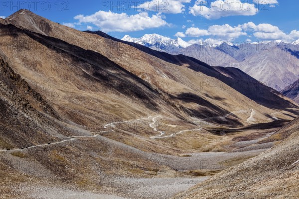 Himalayan valley landscape with road near Kunzum La pass, allegedly the highest motorable pass in