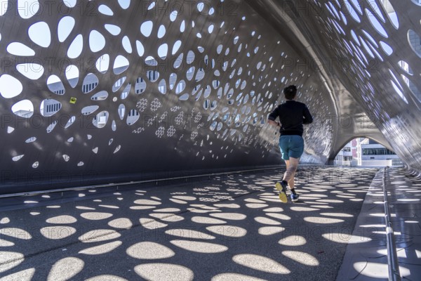 Light effects from the sun in the Parkbruk, a cycle and pedestrian bridge in the city centre of