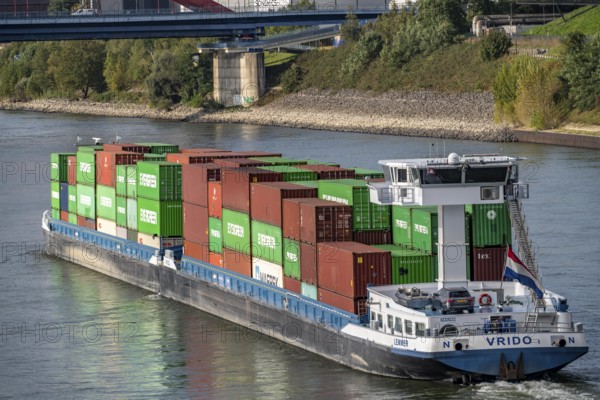 The Dutch cargo ship Vrido, loaded with containers, on the Rhine near Duisburg, downstream, North