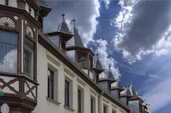 Roof bay with pointed spires on a historic inn, built in 1838, Weingasse 1, Bad Kissingen, Lower