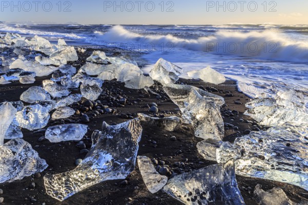 Ice floes on the beach, waves, sea, sunny, morning light, winter, Diamond Beach,