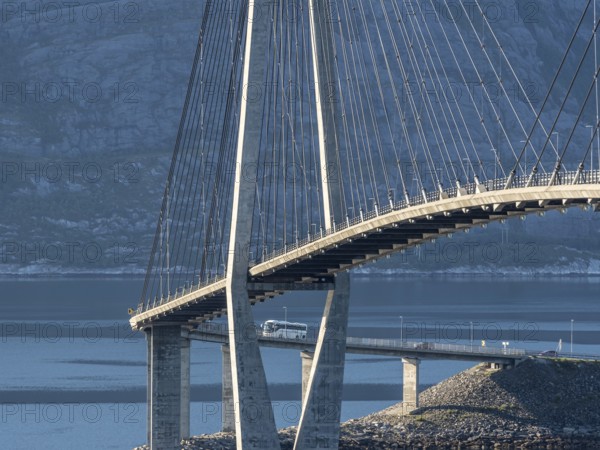 Helgeland bridge, connecting Sandnessjøen with the norwegian mainland, tourbus on bridge, Norway,