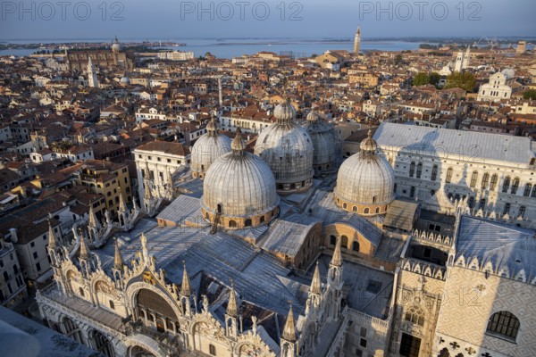 View over the roofs of Venice with St Mark's Basilica and Doge's Palace in the evening light, view