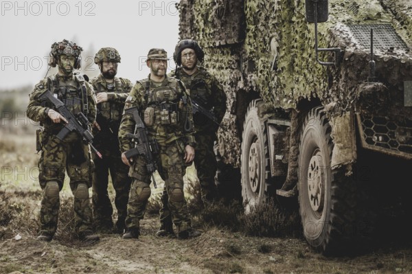 Armed soldiers, photographed as part of a Bundeswehr exercise with armed forces from Norway and the