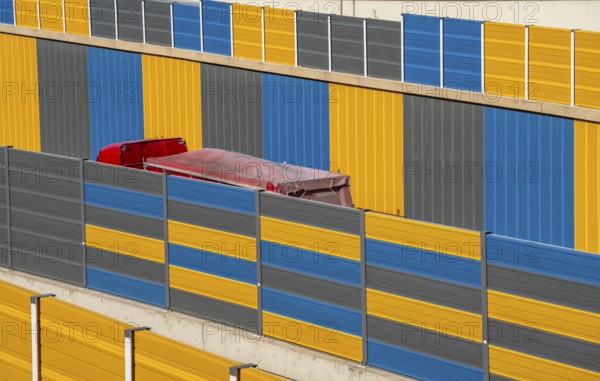 Colourful noise barriers on the A52 motorway, at the Essen-Rüttenscheid junction, the noise