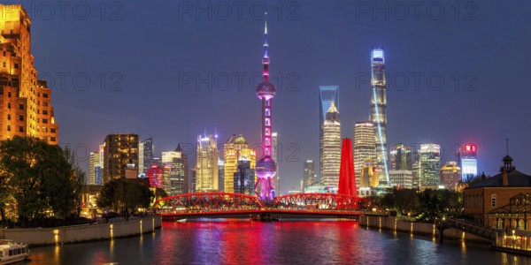 Shanghai skyline at the Bund with Oriental Pearl Tower city centre downtown panorama at night in