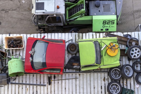 Metals are stored in a scrapyard in the harbour: scrap metal is a valuable raw material for