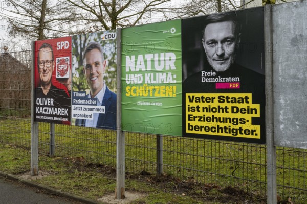 Board with election posters, SPD, CDU, Bündnis90 Die Grünen, FDP, Bundestag election 2025, Kamen,