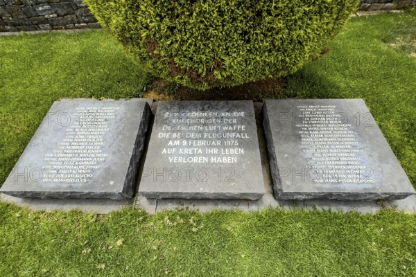 Three memorial plaques at the Maleme military cemetery with the names of the crew of a plane that