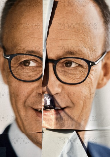 Torn large poster for the Bundestag election 2025 of the CDU with Friedrich Merz, Bochum, Ruhr