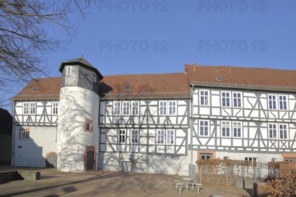 Small castle built in 1564, historic half-timbered house with oriel and turret, Rückingen,
