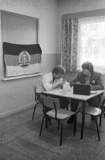 23/09/1982 GDR East Berlin Mitte district. Two tram drivers are taking a break in a canteen of the