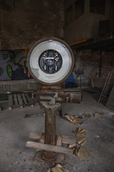 Old abandoned paper factory. Historic and typical factory building as a lost place. Destruction and