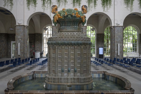 Decorative, Art Nouveau ceramic fountain made of majolica tiles, in the fountain house, Heilbad