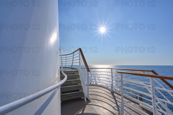 View from the deck of a cruise ship Mein Schiff 6 to the sunny sea and clear sky, North Sea,