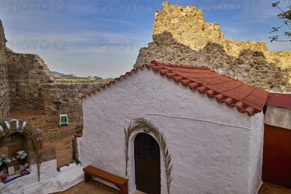 Small chapel with red tiled roof amidst ancient ruins and landscape, Archangelos, castle, place,