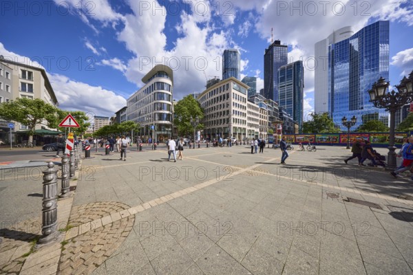 Modern buildings with skyscrapers under a blue sky and cumulus clouds at Opernplatz in Frankfurt am