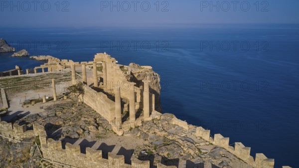 Drone shot, Acropolis of Lindos, late afternoon light, Temple of Athena Lindia, Ruins of an ancient