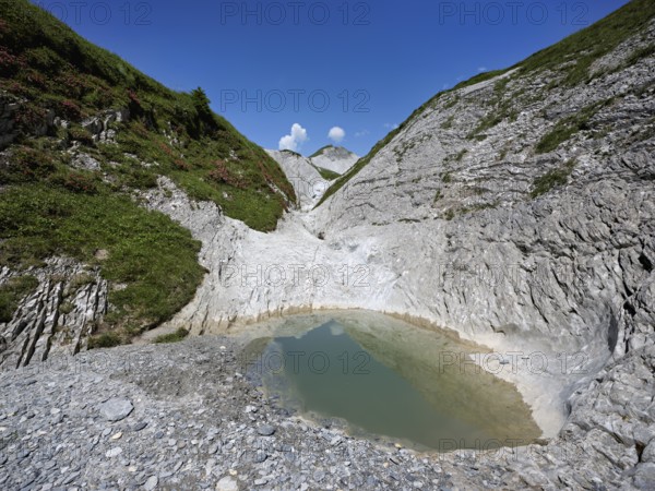 Glacier mill with glacier pots on the Trinser Alp Mora, Trin, Canton Graubünden, Switzerland,