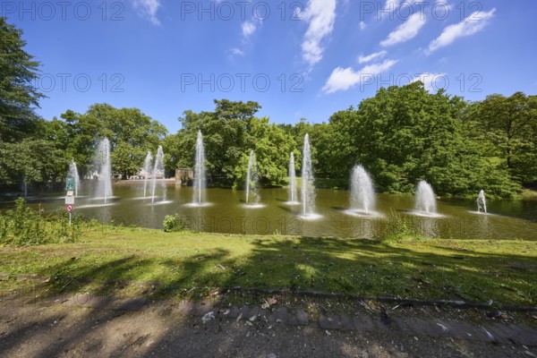Fountain in a pond in Bochum municipal park, Ruhr district, independent city, North