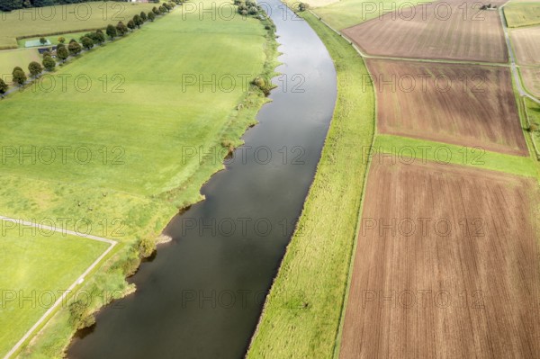 Aerial view over fields and meadows at the Weser river, east of village Wahmbeck, Weserbergland,