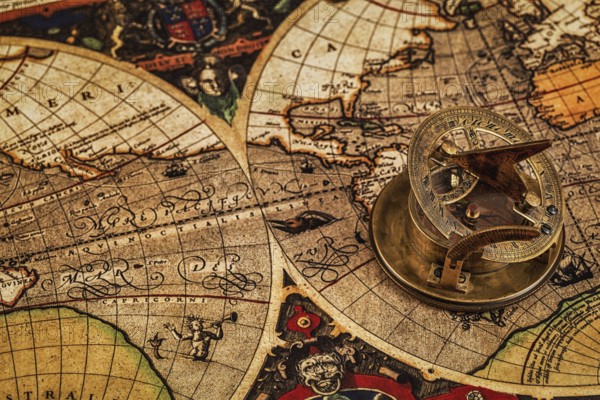Travel geography navigation concept background, old vintage retro compass with sundial on ancient
