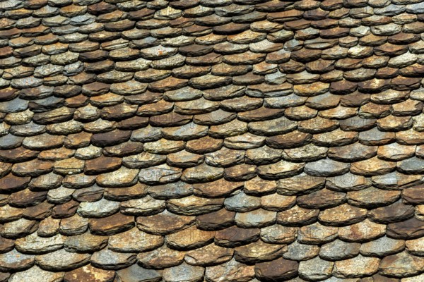 Traditional slate roof (lauze stone) in Auvergne volcanoes regional natural park, Puy de Dome