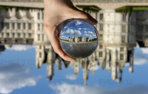 View of the Chateau de Chambord through a transparent ball. Loir-et-Cher department, Centre-Val de