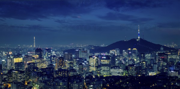 Panorama of Seoul downtown cityscape illuminated with lights and Namsan Seoul Tower in the evening