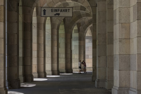 Two men boxing in the arcade of the Congress Hall, unfinished National Socialist monumental