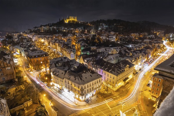 The lights of the snow-covered town of Marburg an der Lahn glow in the evening, Wetterau, Marburg,