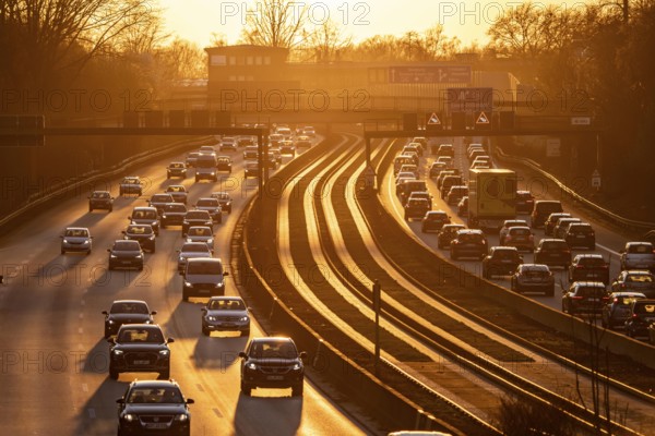 Motorway A40, dense, slow-moving traffic jam, evening traffic at the Essen-Kray junction, low sun,