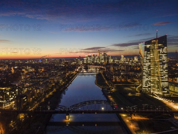 The lights in the offices of the European Central Bank (ECB) and in the skyscrapers of Frankfurt's