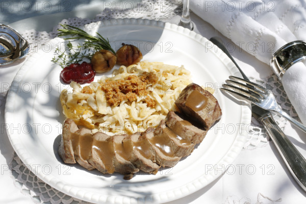Swabian cuisine, roast venison with spaetzle, chestnuts and breadcrumbs, breadcrumbs, saddle of